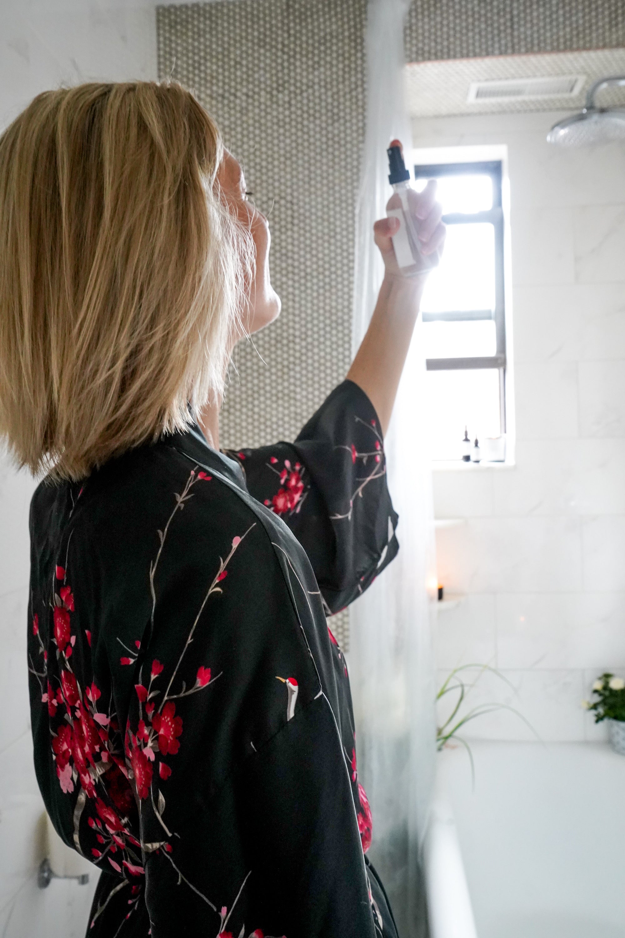 Image of woman using Nourish and Refine Face Mist